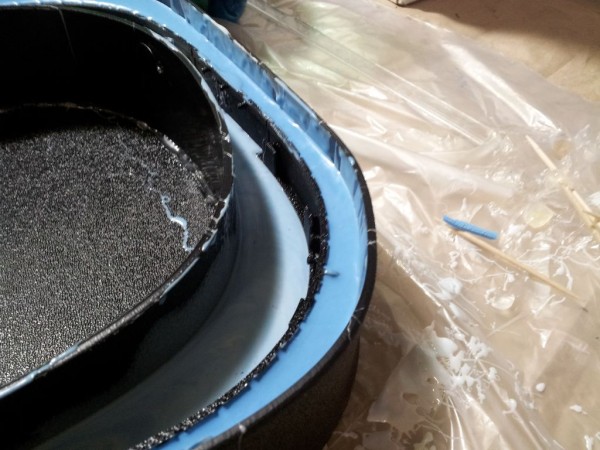 After waiting for the bottom to get slightly harder, a second pour along the outside allows us to create a single mold half that has a parting line halfway up the inside and all the way up the outside. Very tricky.