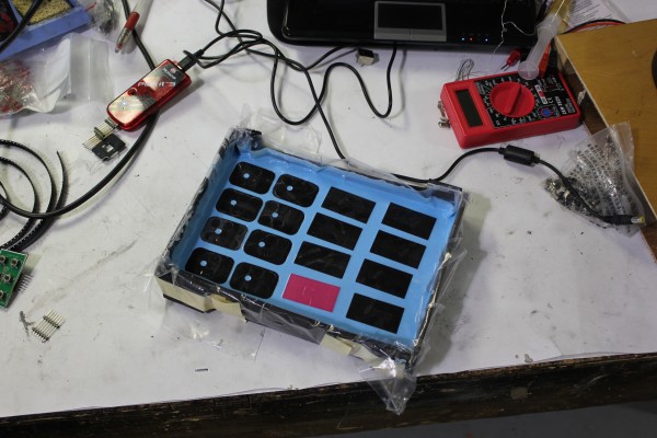 The rubber buttons for the remote and scoreboard were cast out of a rubbery material. To do that, I 3D printed a bunch of positives, created a mold out of them, then cast the parts in the mold. Very time consuming.
